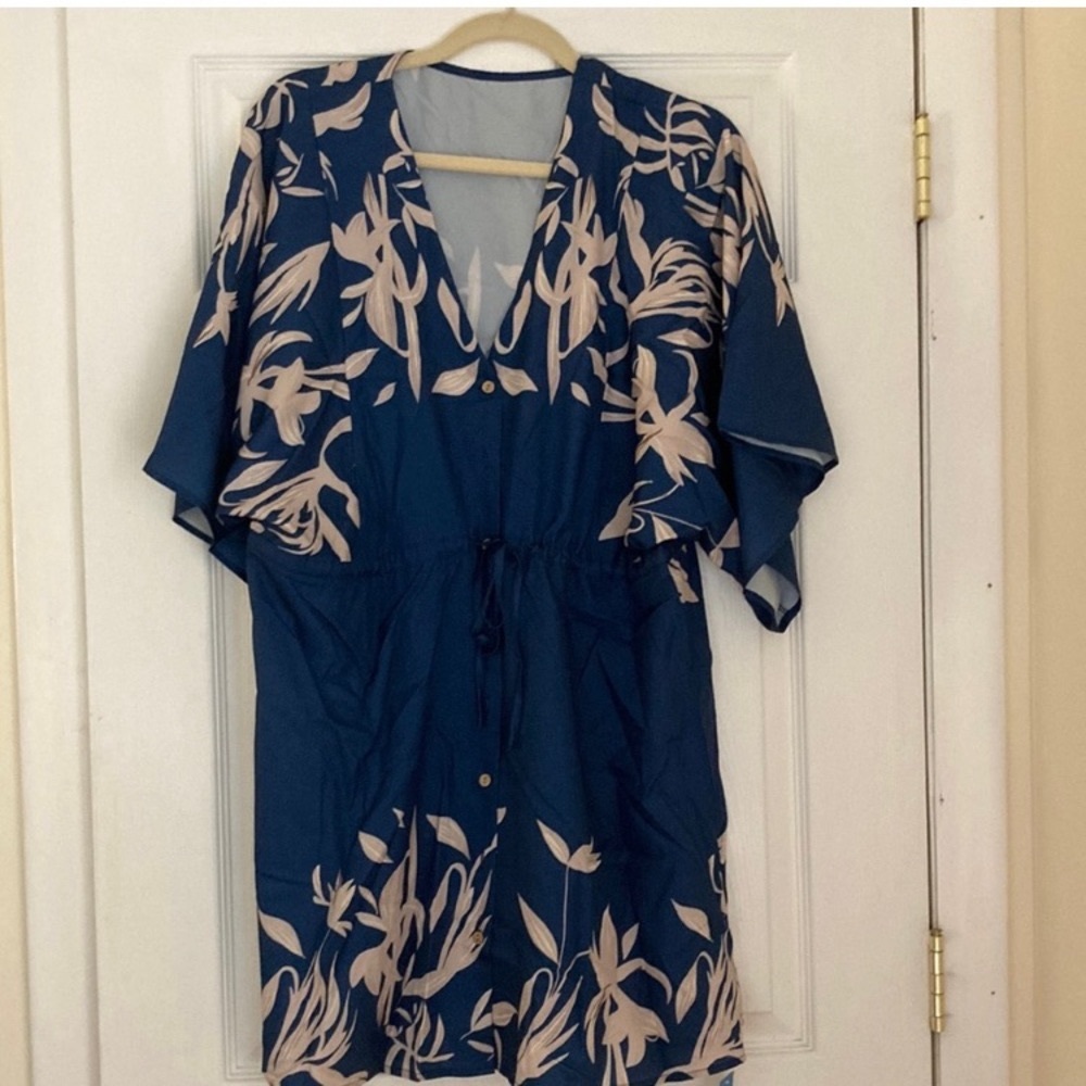 NWT and original packaging. Long sleeve dress with Dolman sleeves.